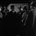 William Holden scharrt die Seinen um sich